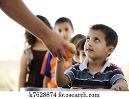Hungry children in refugee camp, distribution of humanitarian food