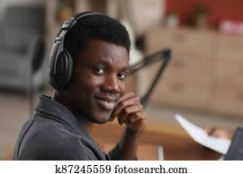 Young African-American Musician Smiling at Camera