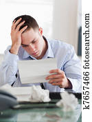 Businessman reading a bill