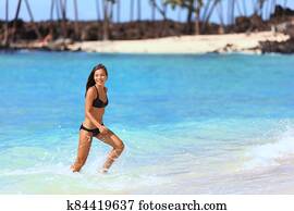 Hawaii beach vacation bikini woman having fun Hawaii beach vacation bikini woman having fun
