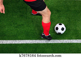 Overhead football player dribbling