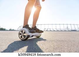 Male feet going on giroscooter