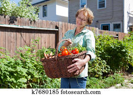 Senior Woman with Vegetables from Garden Senior Woman with Vegetables from Garden