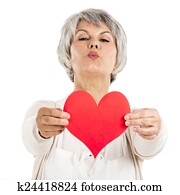 Holding a heart in her hands