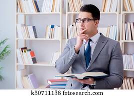 Business law student working studying in the library Business law student working studying in the library