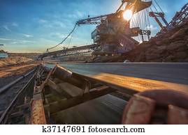 Long conveyor belt transporting ore