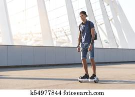 Happy boy going on gyroscope outdoor