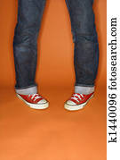 Jeans and sneakers with feet turned outward Stock Photo | u10627727 ...