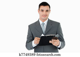 homem negócios, com, clipboard caneta