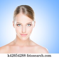 Portrait of a blond woman with arrows on her face Portrait of a blond woman with arrows on her face