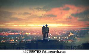 couple standing on the roof top couple standing on the roof top