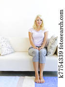 Woman sitting in living room