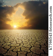 sunset over barren land