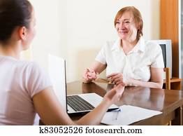Smiling senior woman answer questions Smiling senior woman answer questions