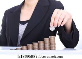 Business women put coin stack money