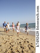 Portrait Of Three Generation Family On Beach Holiday Portrait Of Three Generation Family On Beach Holiday