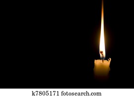 single candle light on black background single candle light on black background