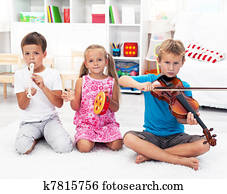 Kids playing on musical instruments Kids playing on musical instruments