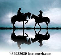 couple on horseback at sunset couple on horseback at sunset