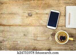 Desktop mix on a wooden office table.