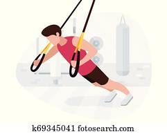 Fit man working out on trx doing bodyweight exercises. Fitness strength training workout. Fit man working out on trx doing bodyweight exercises. Fitness strength training workout.