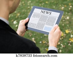 Reading News On Tablet PC Reading News On Tablet PC