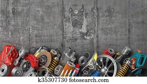 Border of auto parts on concrete wall. Auto service. Border of auto parts on concrete wall. Auto service.