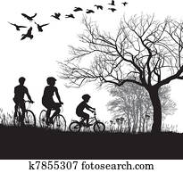 Family cycling in the countryside Family cycling in the countryside