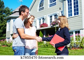 Happy family near new house. Happy family near new house.