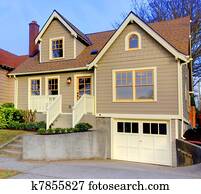 Small new cute brown house with orange doors and windows. Small new cute brown house with orange doors and windows.