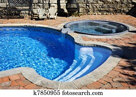 Swimming pool with hot tub