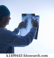 Doctor reading xray.