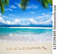 welcome written in beach welcome written in beach
