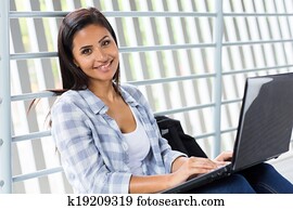college girl using laptop computer