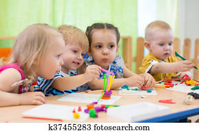 Kids group making arts and crafts in kindergarten Kids group making arts and crafts in kindergarten