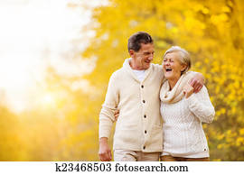 Active seniors walk in nature Active seniors walk in nature