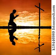 man praying under the cross man praying under the cross