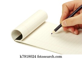 Pencil in hand writing on the notebook Pencil in hand writing on the notebook