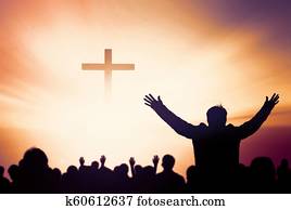 Praise and worship concept:Silhouette of Christian prayers raising hand while praying to the Jesus Praise and worship concept:Silhouette of Christian prayers raising hand while praying to the Jesus