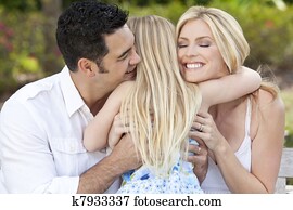 Girl Child Hugging Happy Parents In Park or Garden Girl Child Hugging Happy Parents In Park or Garden