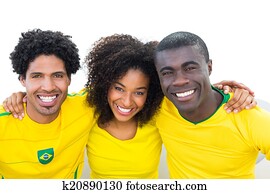 heureux, brésilien, football, ventilateurs, dans, jaune, s'asseoir divan