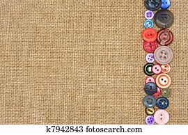 old colorful buttons on the background burlap old colorful buttons on the background burlap