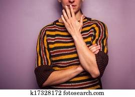 Surprised young woman touching her lip