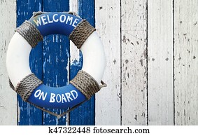 Welcome on board, lifebuoy on wooden background Welcome on board, lifebuoy on wooden background