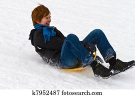 children are sledding down the hill in snow, white winter children are sledding down the hill in snow, white winter