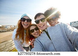 group of happy friends taking selfie on street group of happy friends taking selfie on street