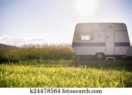 Caravan trailer on rural sunny setting Caravan trailer on rural sunny setting