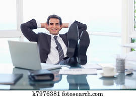 Happy businessman relaxing
