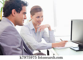 Mentor explains work to his new colleague Mentor explains work to his new colleague