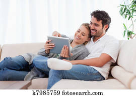In love couple using a tablet computer